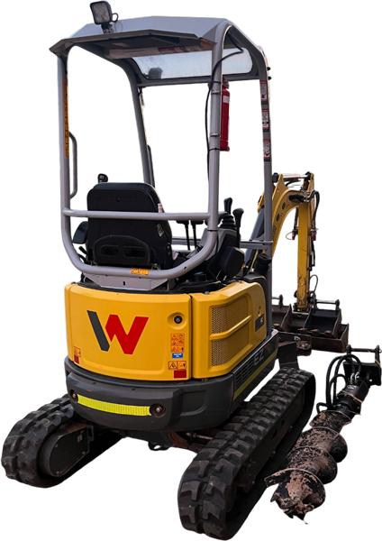 hero-image Yellow mini excavator with an auger attachment